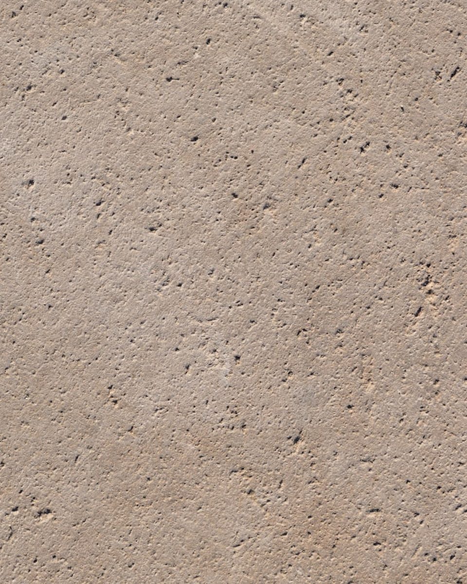 Close detail of the salvaged Ōamaru limestone facing