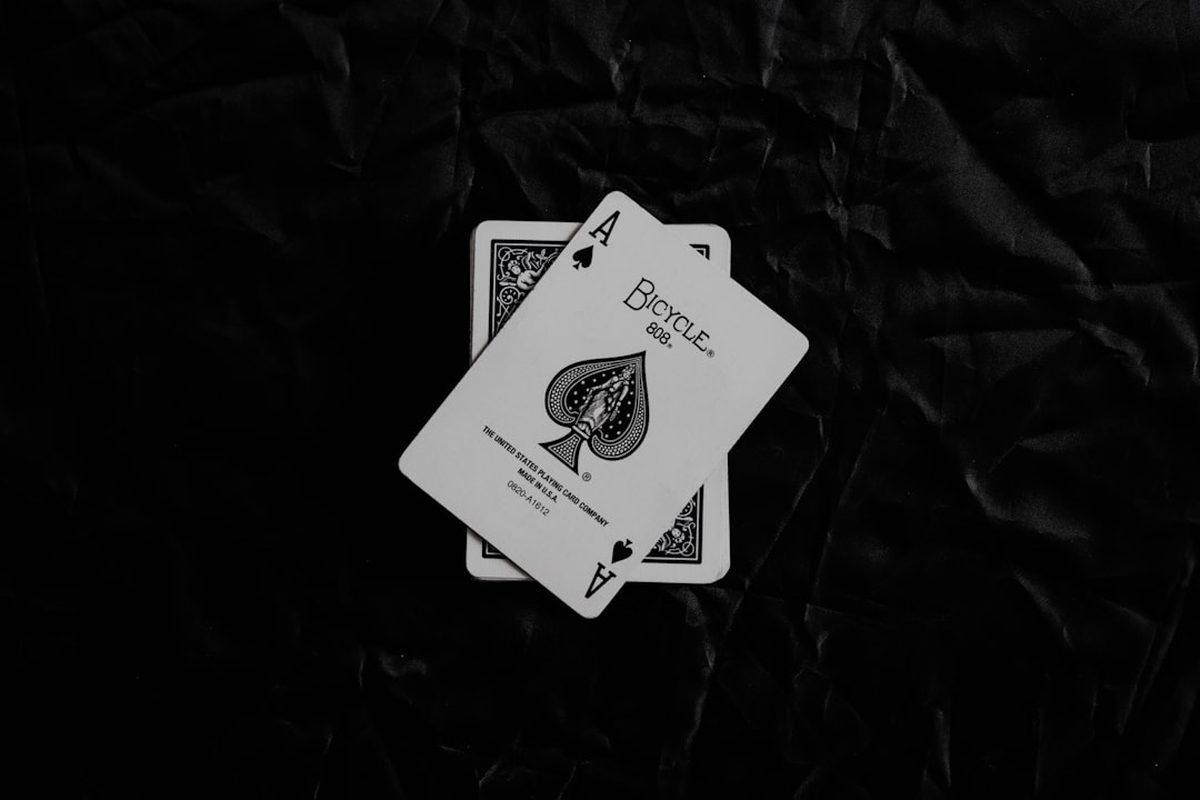 Cards on the baccarat table in the Cape Room