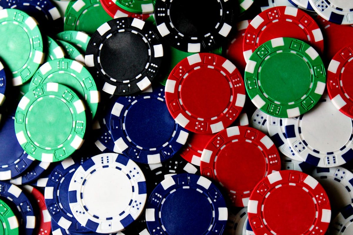 Chips on the felt of a poker table in the Cape Room