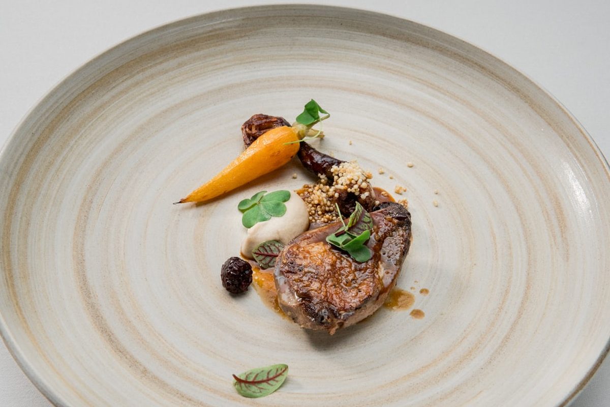 A plated dish of Canterbury lamb in the Norwester Room